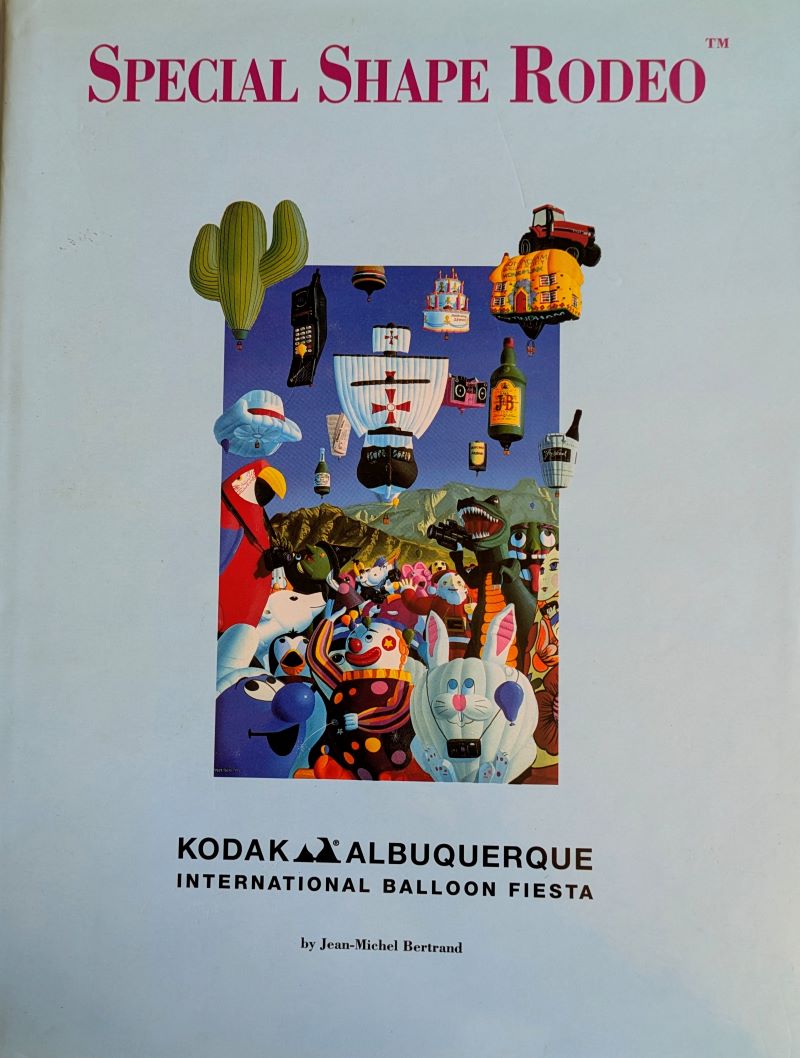 Picture of book cover showing a variety of special shape balloons together in the sky and on the ground